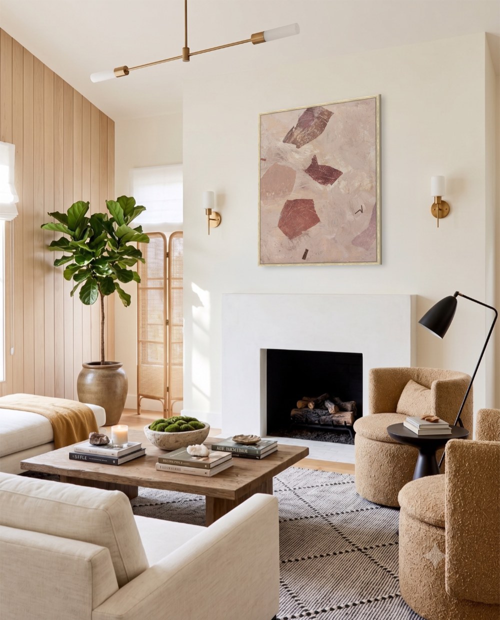 Living room mockup with framed artwork above the fireplace